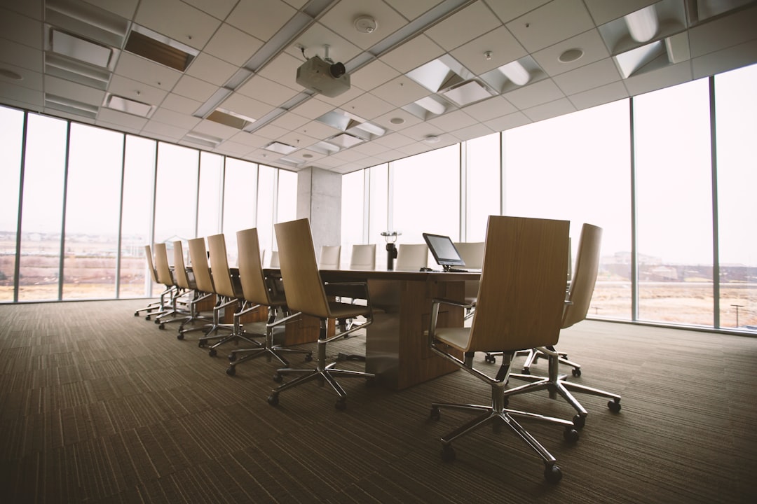 Executive boardroom representing strategic advisory and confidential business decision making