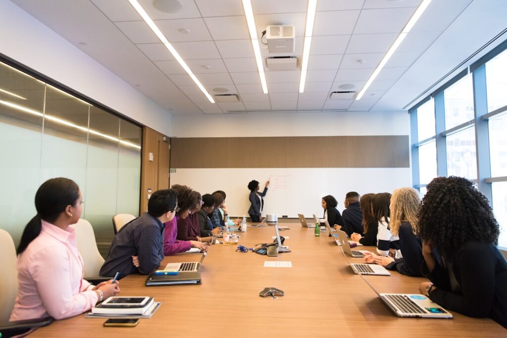 Executive team discussing strategic planning and business decision making in a boardroom